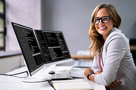 A close-up of a Front-end developer seated in front of her computer display.